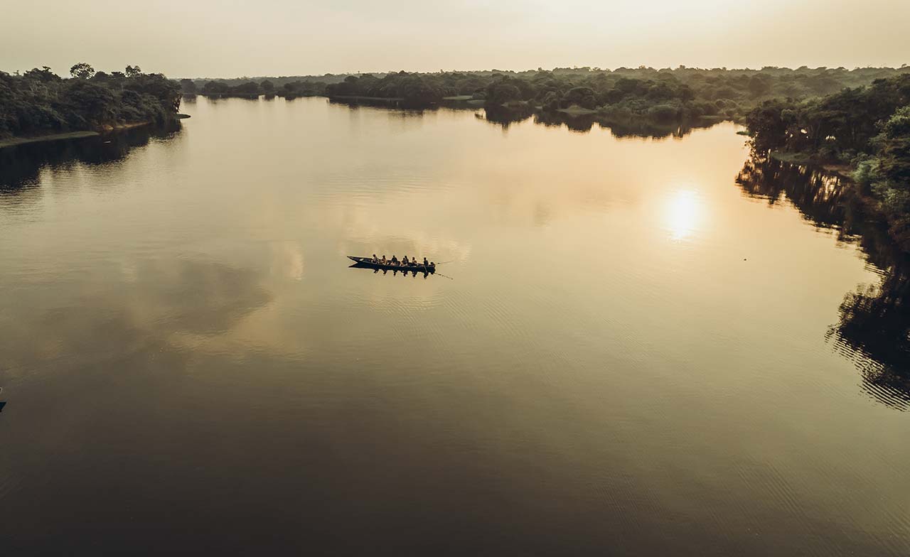 Boat on the Amazon river at Sunset