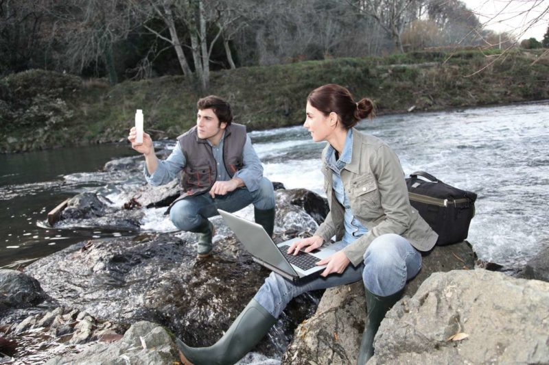 Two scientists checking water samples